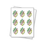 Die cut labels on a white sheet with a holographic finish.