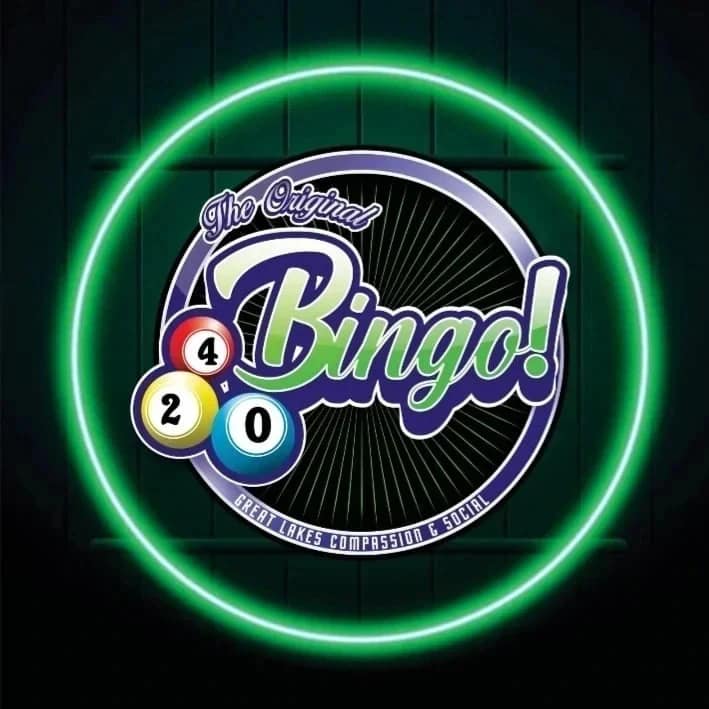 Neon sign with 'Bingo!' and bingo balls on a dark background