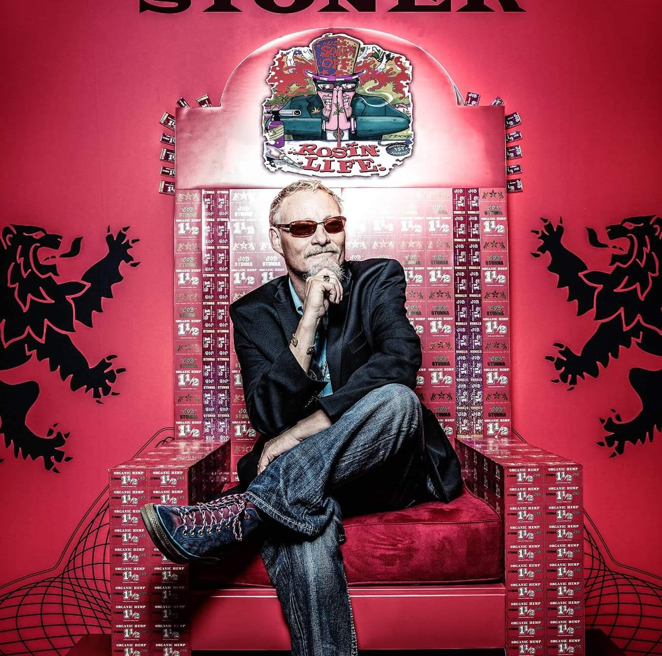 Uncle Stoner sitting on a throne with 'Stoner' and 'Rosin Life' branding on a red background